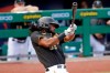 FILE - In this July 22, 2020, file photo, Pittsburgh Pirates' Josh Bell bats during an exhibition baseball game against the Cleveland Indians in Pittsburgh. The Pirates traded the slugging first baseman to Washington on Thursday, Dec. 24, 2020, for pitching prospects Will Crowe and Eddy Yean. (AP Photo/Gene J. Puskar, File)