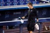 FILE - In this Thursday, July 16, 2020, file photo, a worker sprays the dugout rail to help prevent the spread of the coronavirus, before the Miami Marlins' baseball practice at Marlins Park in Miami. The Marlins, one of the most under-the-radar teams in sports, have making news lately, all of it bad. Overtaken by a coronavirus outbreak, the team must scramble for roster replacements as they try salvage a season barely underway. (AP Photo/Wilfredo Lee, File)
