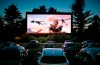 FILE - In this June 26, 2014, file photo, movie-goers watch 