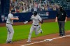 New York Yankees catcher Kyle Higashioka (66) is congratulated by third base coach Phil Nevin after hitting a solo home run against the Tampa Bay Rays during the fifth inning in Game one of a baseball American League Division Series Monday, Oct. 5, 2020, in San Diego. (AP Photo/Gregory Bull)
