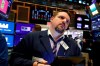 FILE - In this Feb. 24, 2020, file photo trader Michael Milano works on the floor of the New York Stock Exchange. The U.S. stock market opens at 9:30 a.m. EST on Thursday, Feb. 27. (AP Photo/Richard Drew, File)