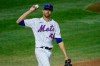 New York Mets starting pitcher Jacob deGrom reacts after allowing a run on a wild pitch during the fourth inning of the team's baseball game against the Boston Red Sox on Wednesday, July 29, 2020, in New York. (AP Photo/John Minchillo)