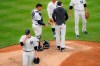 New York Yankees starting pitcher Jordan Montgomery, left, is relieved in the sixth inning of the first baseball game of a doubleheader against the New York Mets, Friday, Aug. 28, 2020, in New York. (AP Photo/John Minchillo)