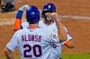 New York Mets' Pete Alonso (20) celebrates with Jeff McNeil (6) after scoring on McNeil's two-run home run during the fourth inning of the team's baseball game against the Baltimore Orioles, Wednesday, Sept. 9, 2020, in New York. (AP Photo/Kathy Willens)
