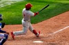 Philadelphia Phillies' Jean Segura hits a two-run home run during the 10th inning of a baseball game against the New York Mets on Monday, Sept. 7, 2020, in New York. (AP Photo/Adam Hunger)