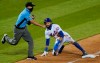 Third base umpire Roberto Ortiz (40) calls New York Mets'Billy Hamilton out on an attempted steal during the ninth inning of the team's baseball game against the New York Met, Thursday, Sept. 3, 2020, in New York. (AP Photo/Kathy Willens)
