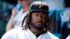 FILE - In this Saturday, June 22, 2019 file photo, Pittsburgh Pirates' Josh Bell waits to take the field for the team's baseball game against the San Diego Padres in Pittsburgh. Pirates first baseman Josh Bell watched George Floyd's death in horror. Rarely one to talk, Bell prefers to have his actions speak for him. Bell, who is Black, has started a book club and a weekly 