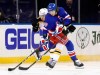 New York Rangers' Artemi Panarin (10) attempts to get past Boston Bruins' Patrice Bergeron (37) during the third period of an NHL hockey game Wednesday, Feb. 10, 2021, in New York. (Bruce Bennett/Pool Photo via AP)