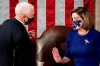 Speaker of the House Nancy Pelosi, D-Calif., and Vice President Mike Pence talk as a joint session of the House and Senate convenes to count the Electoral College votes cast in November's election, at the Capitol in Washington, Wednesday, Jan. 6, 2021. (Erin Schaff/The New York Times via AP, Pool)