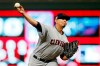 FILE - In this Sept 6, 2019, file photo, Cleveland Indians pitcher Carlos Carrasco throws against the Minnesota Twins in a baseball game in Minneapolis. The Indians’ right-hander, who made a dramatic comeback last season after being diagnosed with leukemia, has been cleared to pitch and is thrilled to be back on the field after baseball was shut down during the COVID-19 pandemic. Carrasco said his health is good and his doctors have approved him playing despite the inherent risks. (AP Photo/Jim Mone, File)