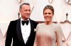 FILE - In this Feb. 9, 2020 file photo, Tom Hanks, left, and Rita Wilson arrive at the Oscars at the Dolby Theatre in Los Angeles. The couple have tested positive for the coronavirus, the actor said in a statement Wednesday, March 11. The 63-year-old actor said they will be 