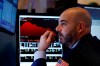 Trader Fred DeMarco works on the floor of the New York Stock Exchange, Friday, Feb. 28, 2020. Global stock markets are falling further on spreading virus fears. (AP Photo/Richard Drew)