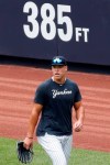 New York Yankees right fielder Aaron Judge (99) watches as a teammate hits in the cage during a summer training camp workout, Wednesday, July 8, 2020, at Yankee Stadium in New York. (AP Photo/Kathy Willens)