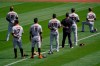 San Francisco Giants' Austin Slater (13) kneels during the national anthem before a baseball game against the Oakland Athletics in Oakland, Calif., Saturday, Sept. 19, 2020. (AP Photo/Jeff Chiu)