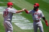 Los Angeles Angels' Mike Trout (27) celebrates after hitting a three-run home run that scored Brian Goodwin (18) and David Fletcher against the Oakland Athletics during the third inning of a baseball game in Oakland, Calif., Sunday, July 26, 2020. (AP Photo/Jeff Chiu)