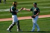 Oakland Athletics catcher Jonah Heim, left, celebrates with pitcher Liam Hendriks after the Athletics defeated the San Diego Padres in a baseball game in Oakland, Calif., Saturday, Sept. 5, 2020. (AP Photo/Jeff Chiu)