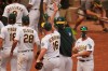 Oakland Athletics pitcher Liam Hendriks (16) celebrates with manager Bob Melvin, center right, after the Athletics defeated the Chicago White Sox 6-4 in Game 3 of an American League wild-card baseball series Thursday, Oct. 1, 2020, in Oakland, Calif. (AP Photo/Eric Risberg)