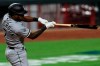 Chicago White Sox's Tim Anderson hits a solo home run in the eighth inning during a baseball game against the Cincinnati Reds in Cincinnati, Saturday, Sept. 19, 2020. (AP Photo/Aaron Doster)