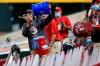 Members of the Reds' grounds crew acknowledge Cincinnati Reds' Trevor Bauer as he stands in the dugout in the ninth inning during a baseball game between the Milwaukee Brewers and the Cincinnati Reds in Cincinnati, Wednesday, Sept. 23, 2020. The Reds won 6-1. (AP Photo/Aaron Doster)