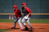 Cincinnati Reds first baseman Joey Votto, right, steps off first base during defensive drills at baseball spring training Wednesday, Feb. 19, 2020, in Goodyear, Ariz. (Kareem Elgazzar/The Cincinnati Enquirer via AP)
