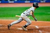 Pittsburgh Pirates' Adam Frazier hits a single off Cleveland Indians starting pitcher Carlos Carrasco during the sixth inning of a baseball game, Friday, Sept. 25, 2020, in Cleveland. (AP Photo/Ron Schwane)