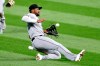 Chicago White Sox's Eloy JimÃ©nez makes a sliding catch to get out Cleveland Indians' Tyler Naquin during the seventh inning of a baseball game, Monday, Sept. 21, 2020, in Cleveland. (AP Photo/Ron Schwane)