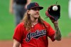 Cleveland Indians starting pitcher Mike Clevinger gets another ball after giving up a home run in the first inning in a baseball game, Wednesday, Aug. 26, 2020, in Cleveland. (AP Photo/Tony Dejak)