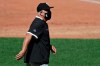 Chicago White Sox manager Rick Renteria walks back to the dugout from the pitcher's mound in the third inning in the first baseball game of a doubleheader against the Cleveland Indians, Tuesday, July 28, 2020, in Cleveland. (AP Photo/Tony Dejak)