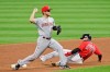 Cincinnati Reds' Josh VanMeter (17) gets Cleveland Indians' Cesar Hernandez (7) out at second base in the fifth inning in a baseball game, Wednesday, Aug. 5, 2020, in Cleveland. (AP Photo/Tony Dejak)