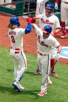 Philadelphia Phillies' Bryce Harper, left, celebrates his three-run home run with J.T. Realmuto, right, during the first inning of a baseball game against the Miami Marlins, Sunday, July 26, 2020, in Philadelphia. (AP Photo/Chris Szagola)