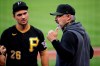 FILE - In this July 15, 2020, file photo, Pittsburgh Pirates manager Derek Shelton, right, talks with Adam Frazier between innings of an intrasquad baseball game at PNC Park in Pittsburgh. The Pirates first-year manager is a mix of old-school grit and new-school analytics nerd. The club also believes he's a breath of fresh air for a franchise in need of a jolt. (AP Photo/Gene J. Puskar, File )