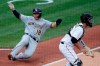 Milwaukee Brewers' Keston Hiura (18) scores on a double by Justin Smoak as Pittsburgh Pirates catcher Jacob Stallings waits for the late relay during the fourth inning of a baseball game in Pittsburgh, Sunday, Aug. 23, 2020. (AP Photo/Gene J. Puskar)