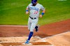 Chicago Cubs' Kyle Schwarber scores from third on a bunt single by Javier Baez during the second inning of a baseball game against the Pittsburgh Pirates in Pittsburgh, Monday, Sept. 21, 2020. (AP Photo/Gene J. Puskar)