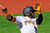 Pittsburgh Pirates' Gregory Polanco drives in a run with a ground rule double to left center field off Cincinnati Reds starting pitcher Luis Castillo during the third inning of the first of two baseball games in Pittsburgh, Friday, Sept. 4, 2020. (AP Photo/Gene J. Puskar)