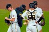 Pittsburgh Pirates relief pitcher Sam Howard, left, walks off the mound after handing the ball to manager Derek Shelton, second from left, during the seventh inning of the team's baseball game against the St. Louis Cardinals in Pittsburgh, Saturday, Sept. 19, 2020. (AP Photo/Gene J. Puskar)