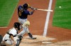 Milwaukee Brewers' Lorenzo Cain drives in a run with a single off Pittsburgh Pirates relief pitcher Nik Turley during the seventh inning of a baseball game in Pittsburgh, Monday, July 27, 2020. (AP Photo/Gene J. Puskar)