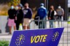 Voters wait in line to cast their ballot in the 2020 Presidential election during early voting in Noblesville, Ind., Wednesday, Oct. 14, 2020. (AP Photo/Michael Conroy, File)