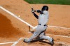 New York Yankees' Gleyber Torres bats in a run-scoring double play off Philadelphia Phillies starting pitcher Zack Wheeler during the first inning of the first baseball game in doubleheader, Wednesday, Aug. 5, 2020, in Philadelphia. (AP Photo/Matt Slocum)