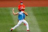 Philadelphia Phillies' Jake Arrieta, front, warms up near manager Joe Girardi during baseball practice at Citizens Bank Park, Tuesday, July 7, 2020, in Philadelphia. (AP Photo/Matt Slocum)