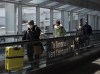 People leave the terminal after arriving at Pearson International Airport in Toronto on Monday, March 16, 2020. Health experts are urging caution after business leaders called on Prime Minister Justin Trudeau and provincial premiers to ease air travel restrictions. Passengers on international flights must self-isolate for 14 days upon arrival in Canada and interprovincial travel is banned in five provinces. THE CANADIAN PRESS/Nathan Denette