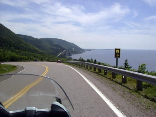 This July 13, 2010 photo shows the road along the Cabot Trail in Cape Breton, Nova Scotia. If you're looking to explore Canada this summer, you'll first have to navigate the fluctuating patchwork of travel restrictions aimed at preventing the spread of the novel coronavirus throughout the country. THE CANADIAN PRESS/AP-Glenn Adams