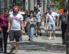 Pedestrians walk on Ste. Catherine street, Thursday, June 18, 2020 in Montreal. A group of 239 scientists and physicians urging the World Health Organization to recognize the potential for airborne transmission of the novel coronavirus have sparked debate over how COVID-19 is spreading.But some Canadian infectious disease experts say not to get hung up on the term 