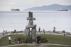 People attempt to physical distance themselves from one another as they walk along the seawall in Vancouver, Tuesday, March 31, 2020. British Columbia's tourism and hospitality sector believes it should receive more than one-third of the $1.5-billion COVID-19 recovery package pledged to the province by the federal government.THE CANADIAN PRESS/Jonathan Hayward