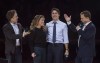 Co-founders Craig (left) and Marc Kielburger introduce Prime Minister Justin Trudeau and his wife Sophie Gregoire-Trudeau as they appear at the WE Day celebrations in Ottawa, Tuesday November 10, 2015. THE CANADIAN PRESS/Adrian Wyld