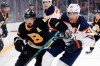 Boston Bruins' David Krejci (46) and Edmonton Oilers' Darnell Nurse (25) battle during the third period on an NHL hockey game in Boston, Saturday, Jan. 4, 2020. Like many sports fans hungry for something, anything, to watch during a spring of self-isolation and physical distancing, Nurse tuned into 