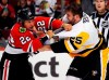 Chicago Blackhawks forward Jordin Tootoo, left, fights Pittsburgh Penguins forward Tom Sestito during the first period of an NHL preseason hockey game Wednesday, Sept. 28, 2016, in Chicago. Tootoo says he doesn't find the Edmonton Eskimos' team name objectionable, but that doesn't mean the CFL club should keep it. THE CANADIAN PRESS/AP/Nam Y. Huh