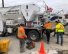 Workers get set to pour cement from a truck at the GO train station in Oakville, Ont., Tuesday, Jan.28, 2020. Statistics Canada is set today to report how many workers lost their jobs in April or had their hours slashed as a result of the COVID-19 pandemic.THE CANADIAN PRESS/Richard Buchan