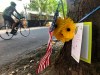 A small memorial to Portland, Oregon fatal shooting victim Aaron J. Danielson, 39, of Portland is shown on Monday, Aug. 31, 2020, at the site where he was killed on Saturday, Aug. 29, 2020, as supporters of President Donald Trump and Black Lives Matter protesters clashed. Danielson was a supporter of the right-wing Patriot Prayer group but few details have emerged about what led up to the shooting. No suspects have been arrested. (AP Photo/Gillian Flaccus)