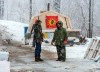 Protesters in support of the Wet'suwet'en hereditary chiefs stand near the entrance to the blockade of the commuter rail line in Kahnawake Mohawk Territory, near Montreal, Thursday, Feb. 27, 2020. THE CANADIAN PRESS/Ryan Remiorz