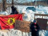 Members of the Mohawk community man a blockade of the commuter rail line Wednesday, February 12, 2020 in Kahnawake, Que..THE CANADIAN PRESS/Ryan Remiorz